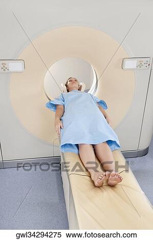 Patient going through an MRI scan View Large Photo Image Stock Photography - Patient going through an MRI scan. Fotosearch