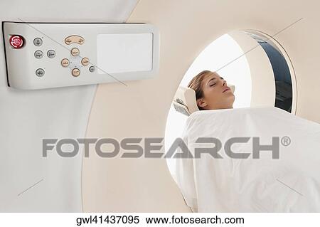 Patient going through an MRI scan View Large Photo Image Stock Photography - Patient going through an MRI scan. Fotosearch