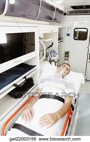 Patient lying in an ambulance View Large Photo Image Stock Photograph - Patient lying in an ambulance. Fotosearch