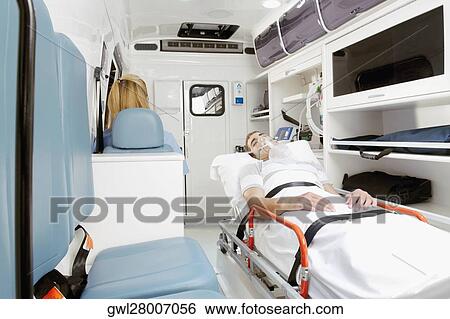 Stock Photograph - Patient lying in an ambulance. Fotosearch