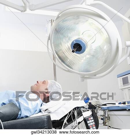 Patient lying on an operation table View Large Photo Image Stock Photo - Patient lying on an operation table. Fotosearch