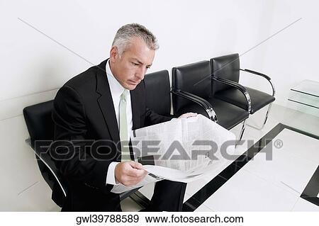 Patient reading a newspaper in a hospital View Large Photo Image Stock Photo - Patient reading a newspaper in a hospital. Fotosearch
