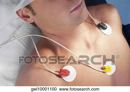 Patient undergoing electrocardiogram test View Large Photo Image Stock Image - Patient undergoing electrocardiogram test. Fotosearch