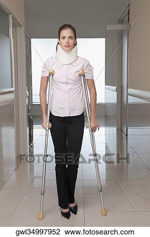 Patient walking with the help of crutches View Large Photo Image Stock Image - Patient walking with the help of crutches. Fotosearch