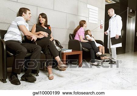 Patients and a doctor in a waiting room View Large Photo Image Stock Photo - Patients and a doctor in a waiting room. Fotosearch