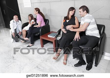 Patients and a doctor in a waiting room View Large Photo Image Stock Photograph - Patients and a doctor in a waiting room. Fotosearch