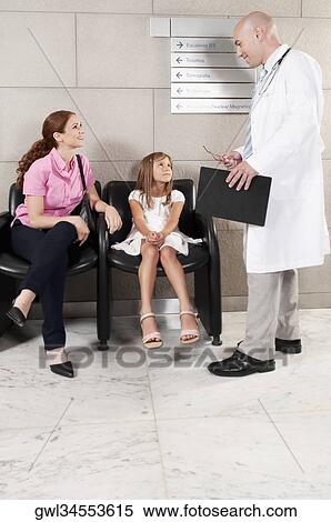 Patients and a doctor in a waiting room View Large Photo Image Stock Photography - Patients and a doctor in a waiting room. Fotosearch
