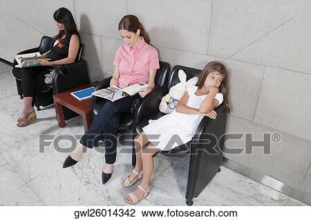 Stock Image - Patients in a hospital waiting room. Fotosearch