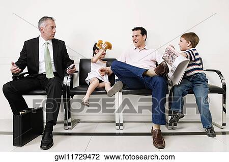 Stock Image - Patients waiting in a hospital. Fotosearch