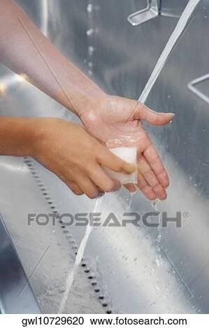 Person washing hands View Large Photo Image Stock Image - Person washing hands. Fotosearch