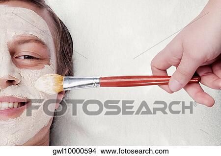 Person's hand applying face pack on a man's face View Large Photo Image Picture - Person's hand applying face pack on a man's face. Fotosearch