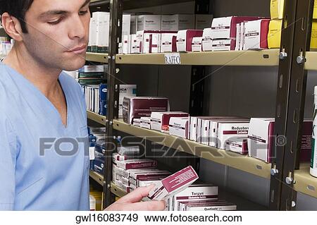 Stock Photo - Pharmacist in a pharmacy. Fotosearch