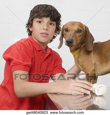 Portrait of a boy with a dog View Large Photo Image Stock Image - Portrait of a boy with a dog. Fotosearch