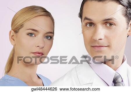 Portrait of a doctor and a nurse View Large Photo Image Stock Photograph - Portrait of a doctor and a nurse. Fotosearch