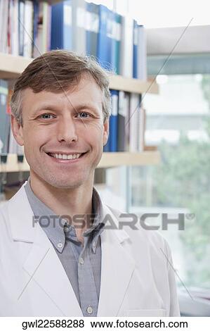 Portrait of a doctor smiling in a laboratory View Large Photo Image Stock Photo - Portrait of a doctor smiling in a laboratory. Fotosearch