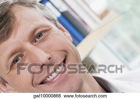 Portrait of a doctor smiling in a laboratory View Large Photo Image Stock Photograph - Portrait of a doctor smiling in a laboratory. Fotosearch
