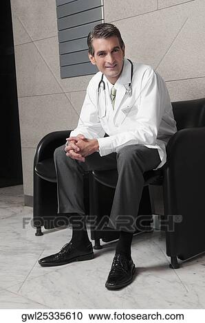 Portrait of a doctor smiling View Large Photo Image Stock Image - Portrait of a doctor smiling. Fotosearch
