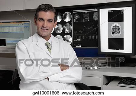 Portrait of a doctor smiling View Large Photo Image Stock Photograph - Portrait of a doctor smiling. Fotosearch