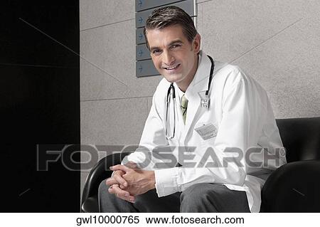 Portrait of a doctor smiling View Large Photo Image Stock Photography - Portrait of a doctor smiling. Fotosearch