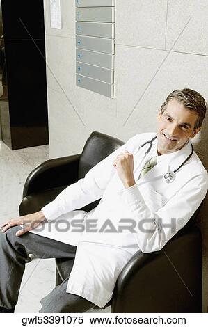 Portrait of a doctor smiling View Large Photo Image Stock Photography - Portrait of a doctor smiling. Fotosearch