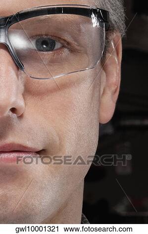 Portrait of a doctor wearing protective eyewear View Large Photo Image Stock Image - Portrait of a doctor wearing protective eyewear. Fotosearch