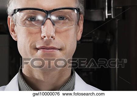 Portrait of a doctor wearing protective eyewear View Large Photo Image Stock Photograph - Portrait of a doctor wearing protective eyewear. Fotosearch