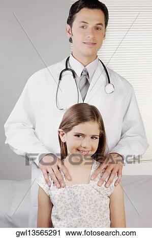 Portrait of a doctor with a girl View Large Photo Image Stock Image - Portrait of a doctor with a girl. Fotosearch