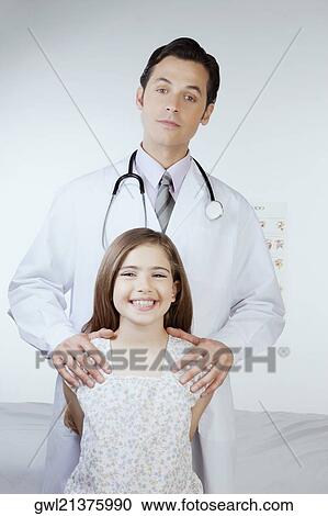 Portrait of a doctor with a girl View Large Photo Image Stock Image - Portrait of a doctor with a girl. Fotosearch