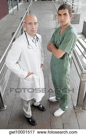 Portrait of a doctor with a male nurse View Large Photo Image Stock Photo - Portrait of a doctor with a male nurse. Fotosearch