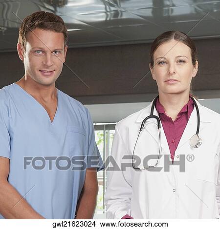 Portrait of a female doctor and a male nurse View Large Photo Image Picture - Portrait of a female doctor and a male nurse. Fotosearch