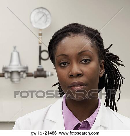 Portrait of a female doctor in a laboratory View Large Photo Image Stock Photograph - Portrait of a female doctor in a laboratory. Fotosearch