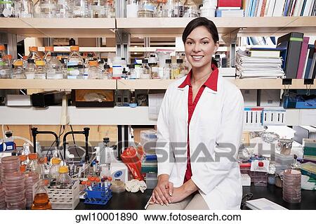 Portrait of a female doctor smiling in a laboratory View Large Photo Image Stock Image - Portrait of a female doctor smiling in a laboratory. Fotosearch