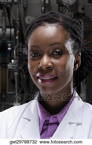 Portrait of a female doctor smiling in a laboratory View Large Photo Image Stock Image - Portrait of a female doctor smiling in a laboratory. Fotosearch