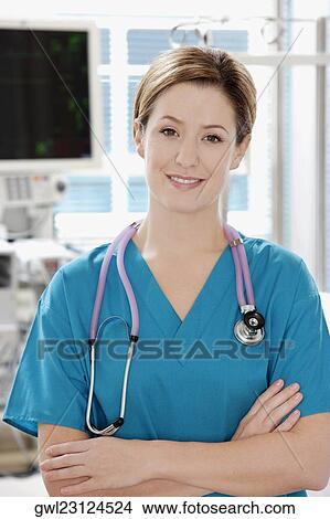 Portrait of a female doctor smiling View Large Photo Image Picture - Portrait of a female doctor smiling. Fotosearch
