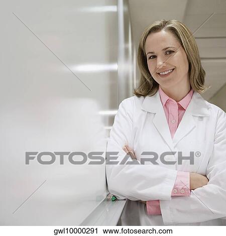 Stock Image - Portrait of a female doctor smiling. Fotosearch