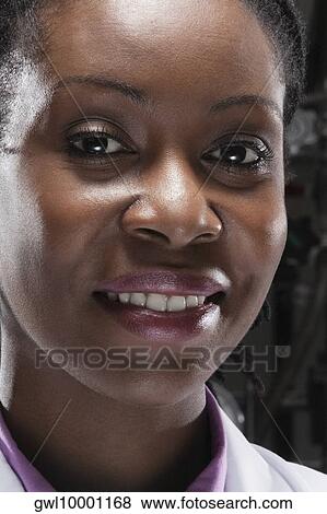 Portrait of a female doctor smiling View Large Photo Image Stock Photo - Portrait of a female doctor smiling. Fotosearch