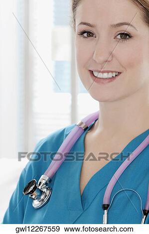 Stock Photo - Portrait of a female doctor smiling. Fotosearch