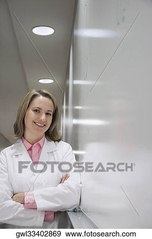 Portrait of a female doctor smiling View Large Photo Image Stock Photo - Portrait of a female doctor smiling. Fotosearch