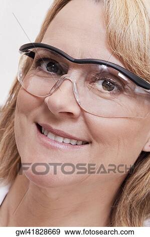 Portrait of a female doctor smiling View Large Photo Image Stock Photo - Portrait of a female doctor smiling. Fotosearch