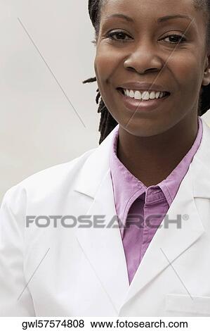 Portrait of a female doctor smiling View Large Photo Image Stock Photo - Portrait of a female doctor smiling. Fotosearch