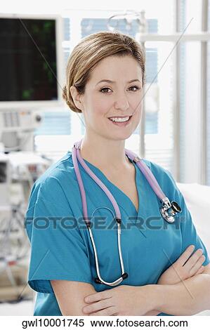 Stock Photography - Portrait of a female doctor smiling. Fotosearch