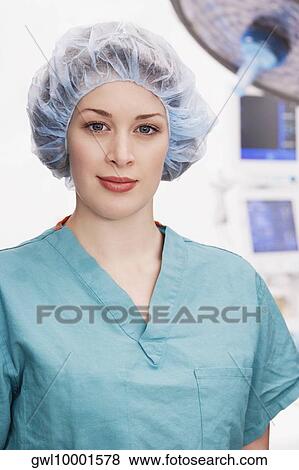 Portrait of a female doctor smirking View Large Photo Image Stock Photo - Portrait of a female doctor smirking. Fotosearch