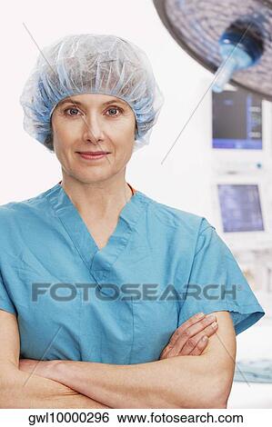 Portrait of a female doctor smirking View Large Photo Image Stock Photograph - Portrait of a female doctor smirking. Fotosearch
