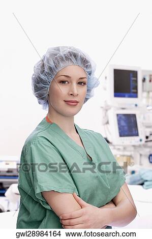 Portrait of a female doctor standing with her arms crossed View Large Photo Image Picture - Portrait of a female doctor standing with her arms crossed. Fotosearch