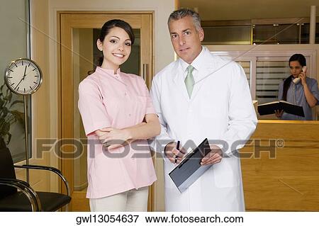 Stock Photo - Portrait of a female doctor with a male doctor. Fotosearch