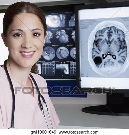 Portrait of a female doctor with MRI report View Large Photo Image Stock Photo - Portrait of a female doctor with MRI report. Fotosearch