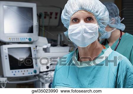Portrait of a female surgeon in an operating room View Large Photo Image Stock Image - Portrait of a female surgeon in an operating room. Fotosearch