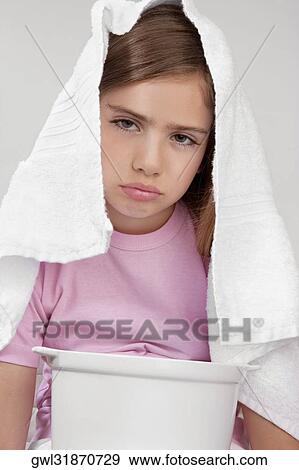 Portrait of a girl inhaling steam View Large Photo Image Stock Photo - Portrait of a girl inhaling steam. Fotosearch
