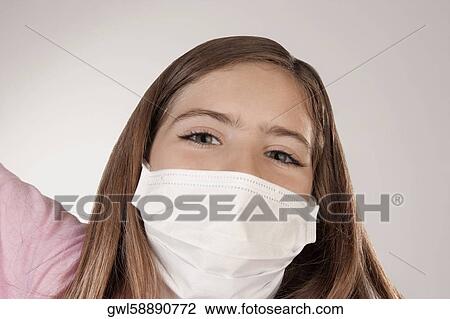 Portrait of a girl wearing a flu mask View Large Photo Image Stock Image - Portrait of a girl wearing a flu mask. Fotosearch