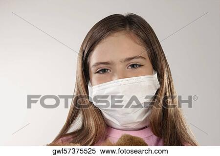 Portrait of a girl wearing a flu mask View Large Photo Image Stock Photography - Portrait of a girl wearing a flu mask. Fotosearch